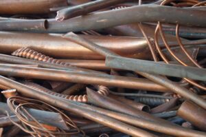 A pile of copper pipes and tubes.